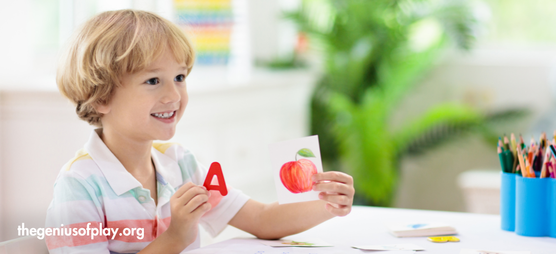 young child learning to read with phonetic flash cards